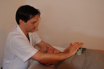 Marcos performing a polarity therapy as part of a client treatment