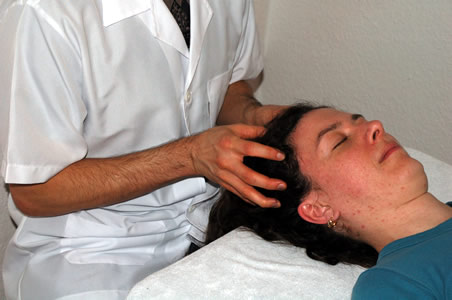 Marcos performing a Facial lift massage as part of a client treatment</perch:content>