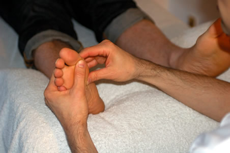 Marcos performing a Reflexology treatment</perch:content>