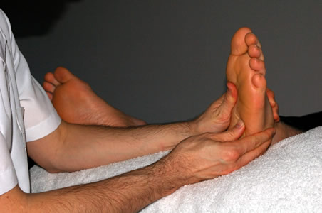 Marcos performing a Reflexology treatment</perch:content>
