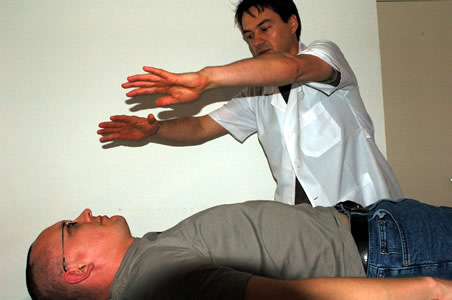 Marcos performing a Polarity therapy technique as part of a client treatment</perch:content>