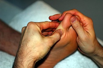 Reflexology treatment - working on the big toe